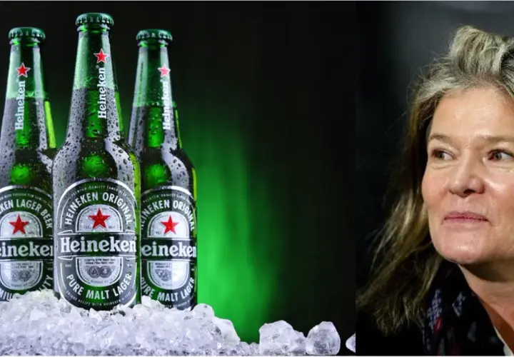 Trois bouteilles de bière Heineken sur de la glace. La famille Heineken possède cette marque emblématique.